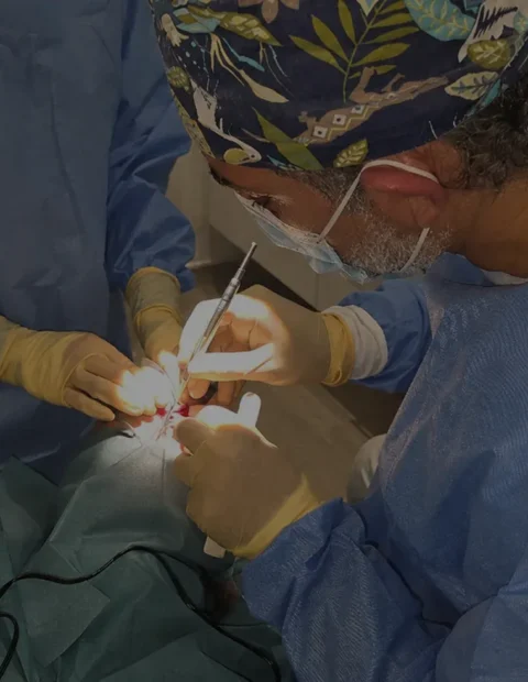 Surgeon performing skin cancer excision surgery in theatre